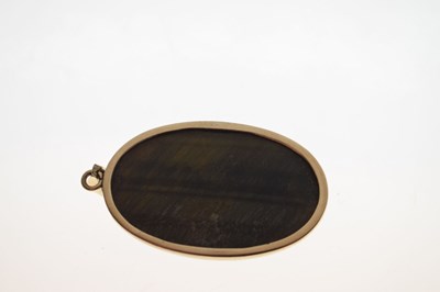 Lot 43 - Tigers eye yellow metal pendant