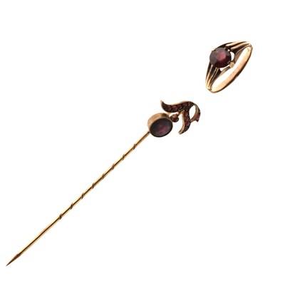 Lot 133 - Early 20th century garnet dress ring, plus a stick pin (2)