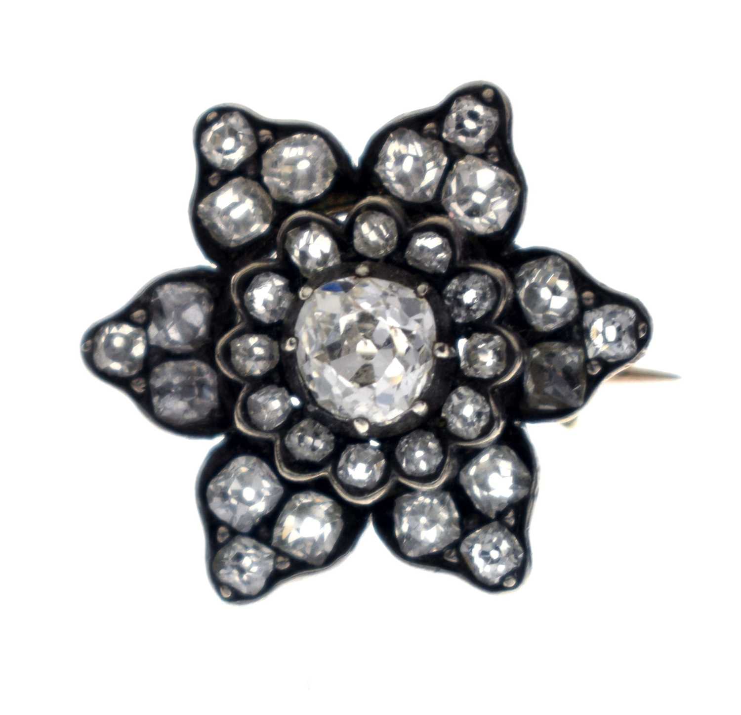 Lot 36 - Late 19th century diamond unmarked yellow and white metal flower head brooch