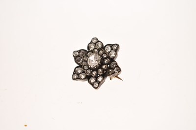 Lot 36 - Late 19th century diamond unmarked yellow and white metal flower head brooch
