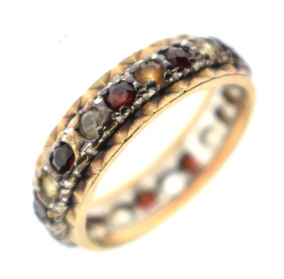 Lot 124 - Garnet and white stone 9ct gold eternity ring