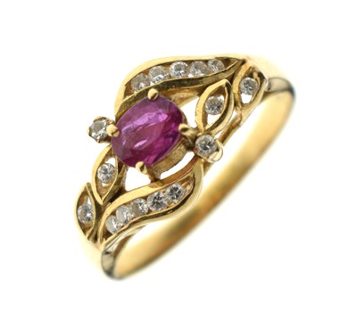 Lot 113 - Ruby and diamond dress ring, stamped '750'