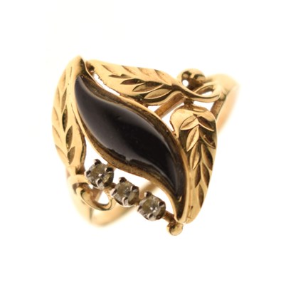 Lot 121 - Modern onyx and diamond yellow metal dress ring