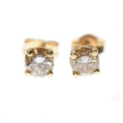 Lot 217 - Pair of diamond single stone ear studs, stamped '14K'