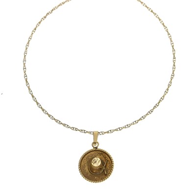 Lot 179 - Sombrero yellow metal pendant, stamped '14K' on a 9ct gold chain