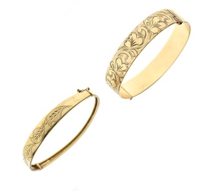Lot 193 - 9ct gold hinged bangle, together with a rolled gold bangle