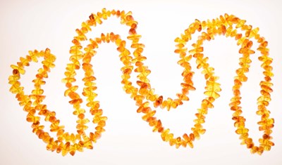Lot 186 - Amber-type tumbled bead long necklace