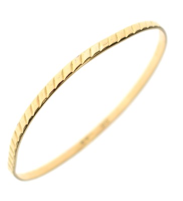 Lot 209 - Yellow metal bangle, stamped '21K'