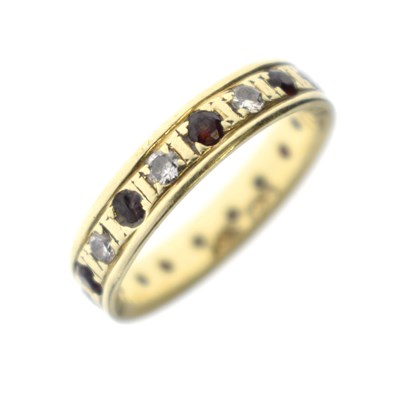 Lot 111 - Gem-set eternity ring, stamped 18K