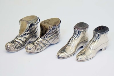 Lot 261 - Four silver novelty pin cushions, each formed as a shoe or boot