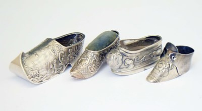 Lot 263 - Four white-metal novelty miniature shoes