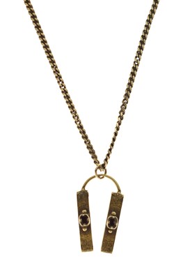 Lot 170 - 9ct gold flat curb link chain necklace with garnet set yellow metal pendant