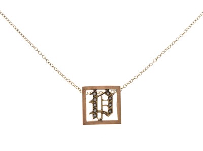 Lot 167 - Initial 'P' pendant set with seed pearls within a square frame, stamped '9ct'