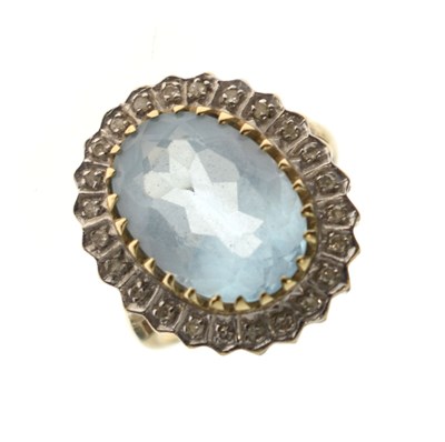 Lot 120 - Topaz and diamond 9ct gold cluster ring