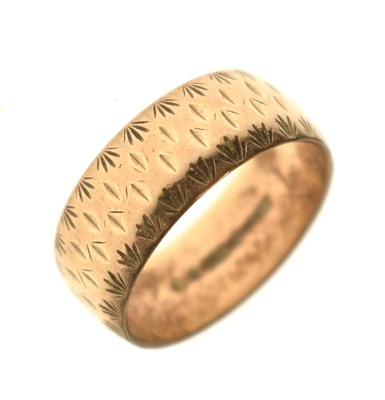 Lot 145 - 9ct gold wedding band with engraved decoration