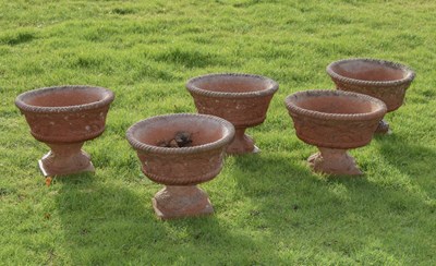 Lot 533 - Set of five 'Sandford Stone' terracotta coloured composition pedestal garden planters