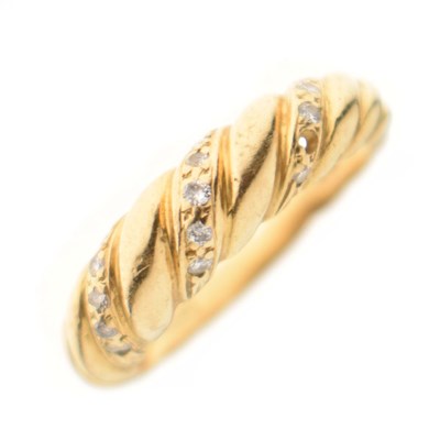 Lot 31 - 18ct gold and diamond twist ring
