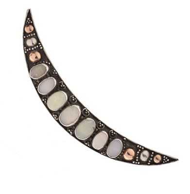 Lot 66 - Crescent-shaped white metal brooch, set seven opal cabochons