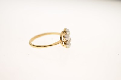 Lot 15 - Late 19th / Early 20th century diamond and pearl yellow metal flower head ring