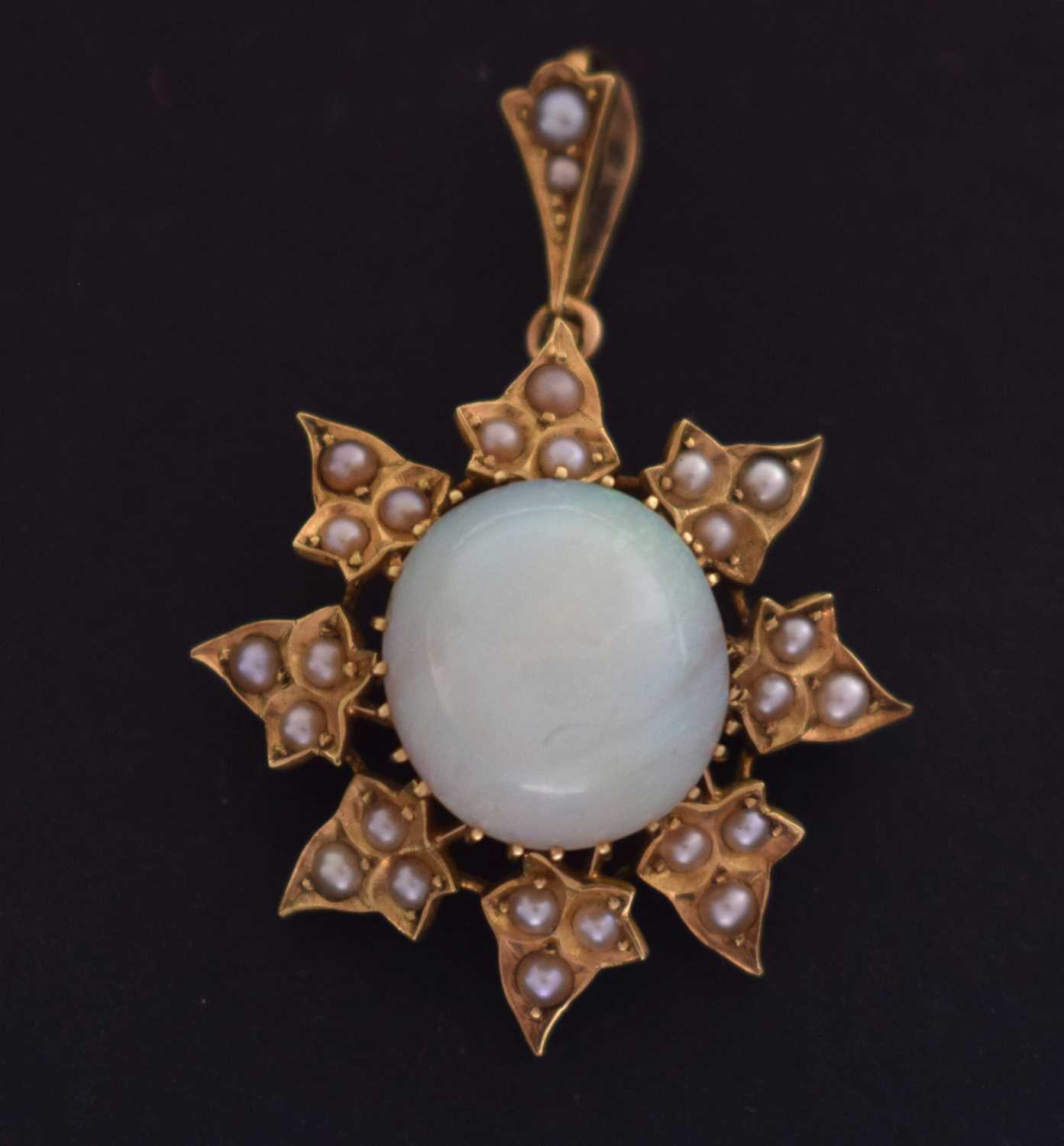 Lot 47 - Late 19th century opal and seed pearl unmarked yellow metal pendant brooch