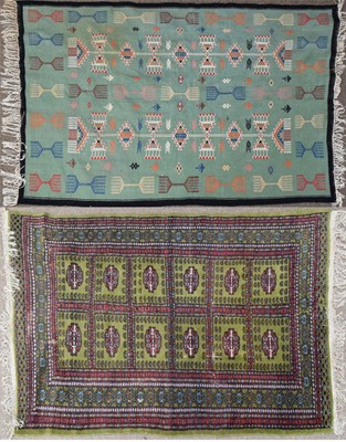 Lot 528 - Tekke style green ground wool rug and a kilim
