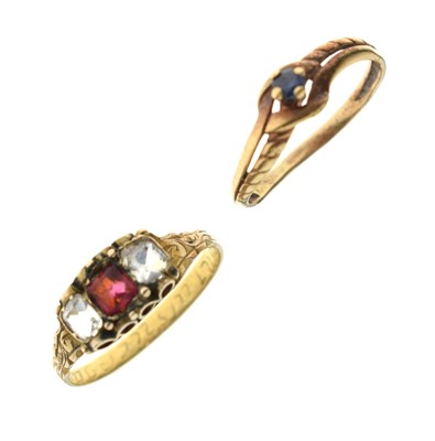 Lot 12 - Sapphire yellow metal dress ring and a red and white paste dress ring