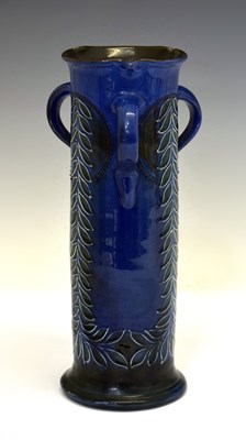 Lot 328 - Charles Brannum (Barnstaple, Devon) vase of sleeve form with shaped rim and three lug handles