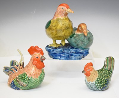 Lot 438 - Two Famille Verte style porcelain cockerels and a pair of Mandarin ducks