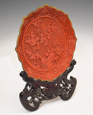 Lot 439 - Chinese red imitation cinnebar lacquer 'lotus' dish and stand