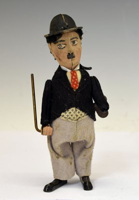 Lot 303 - Schuco - 1930s Charlie Chaplin tinplate clockwork figure