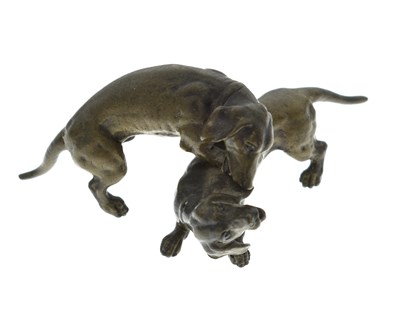 Lot 239 - Small cast bronze figure group of a pair of dachshund dogs