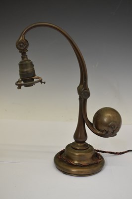 Lot 266 - Tiffany Studios, a counter-balance patinated bronze desk lamp with ‘favrile’ glass shade