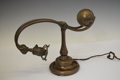 Lot 266 - Tiffany Studios, a counter-balance patinated bronze desk lamp with ‘favrile’ glass shade