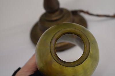 Lot 266 - Tiffany Studios, a counter-balance patinated bronze desk lamp with ‘favrile’ glass shade