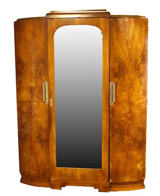 Lot 599 - French Art Deco walnut bowfront triple wardrobe (armoire)