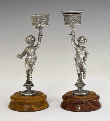 Lot 177 - Pair of Elizabeth II silver figural candlesticks on marbled effect bases