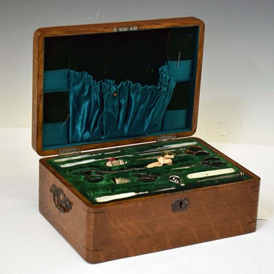 Lot 248 - Late Victorian oak sewing / vanity box with accessories - Finnigan of Manchester, 1900 inscription