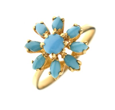Lot 26 - Iranian turquoise yellow metal flower head dress ring