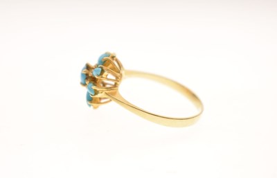 Lot 26 - Iranian turquoise yellow metal flower head dress ring