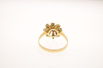Lot 26 - Iranian turquoise yellow metal flower head dress ring