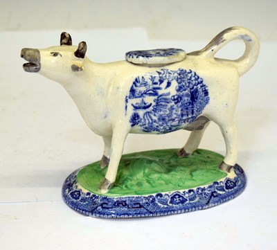 Lot 412 - Pottery cow creamer