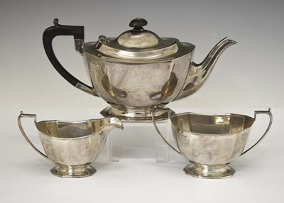 Lot 180 - Elizabeth II silver three-piece tea set of shaped rectagular form