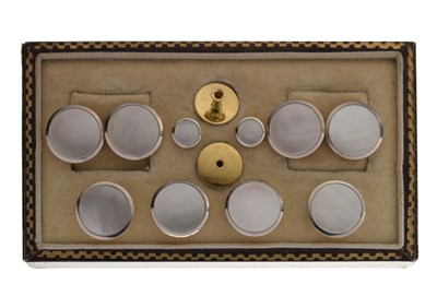 Lot 101 - 18ct yellow metal, platinum and mother-of-pearl set cufflink and dress stud set