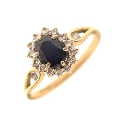 Lot 16 - Sapphire and diamond 18ct gold cluster ring
