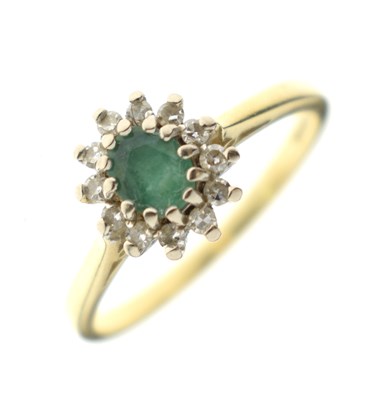 Lot 33 - Emerald and diamond 18ct gold cluster ring
