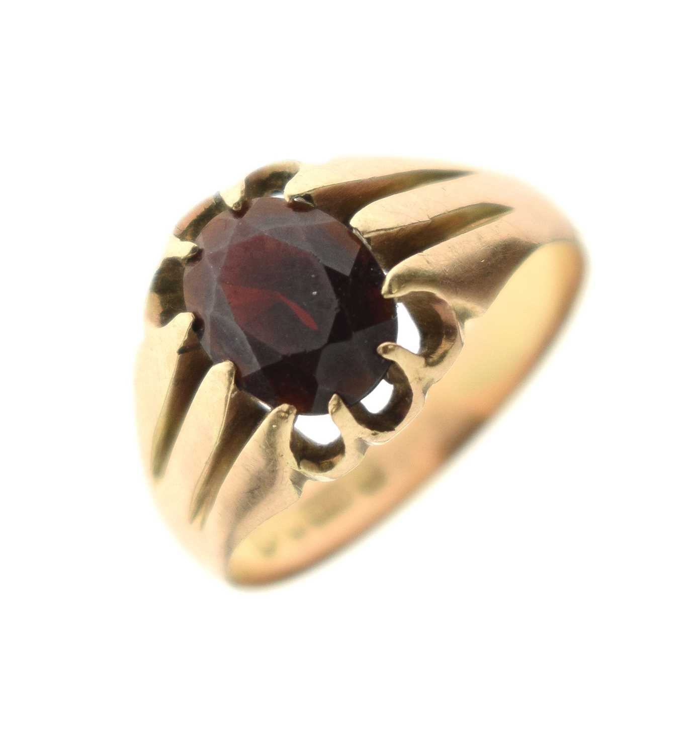 Lot 21 - George V garnet 9ct gold dress ring