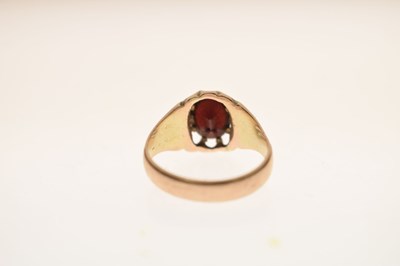 Lot 21 - George V garnet 9ct gold dress ring