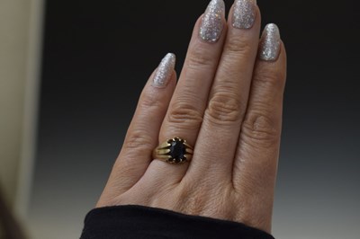 Lot 21 - George V garnet 9ct gold dress ring