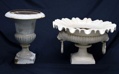 Lot 640 - Two white painted cast iron garden urns