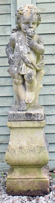 Lot 641 - Composition stone garden figural statue of a cherub, together with a pedestal base